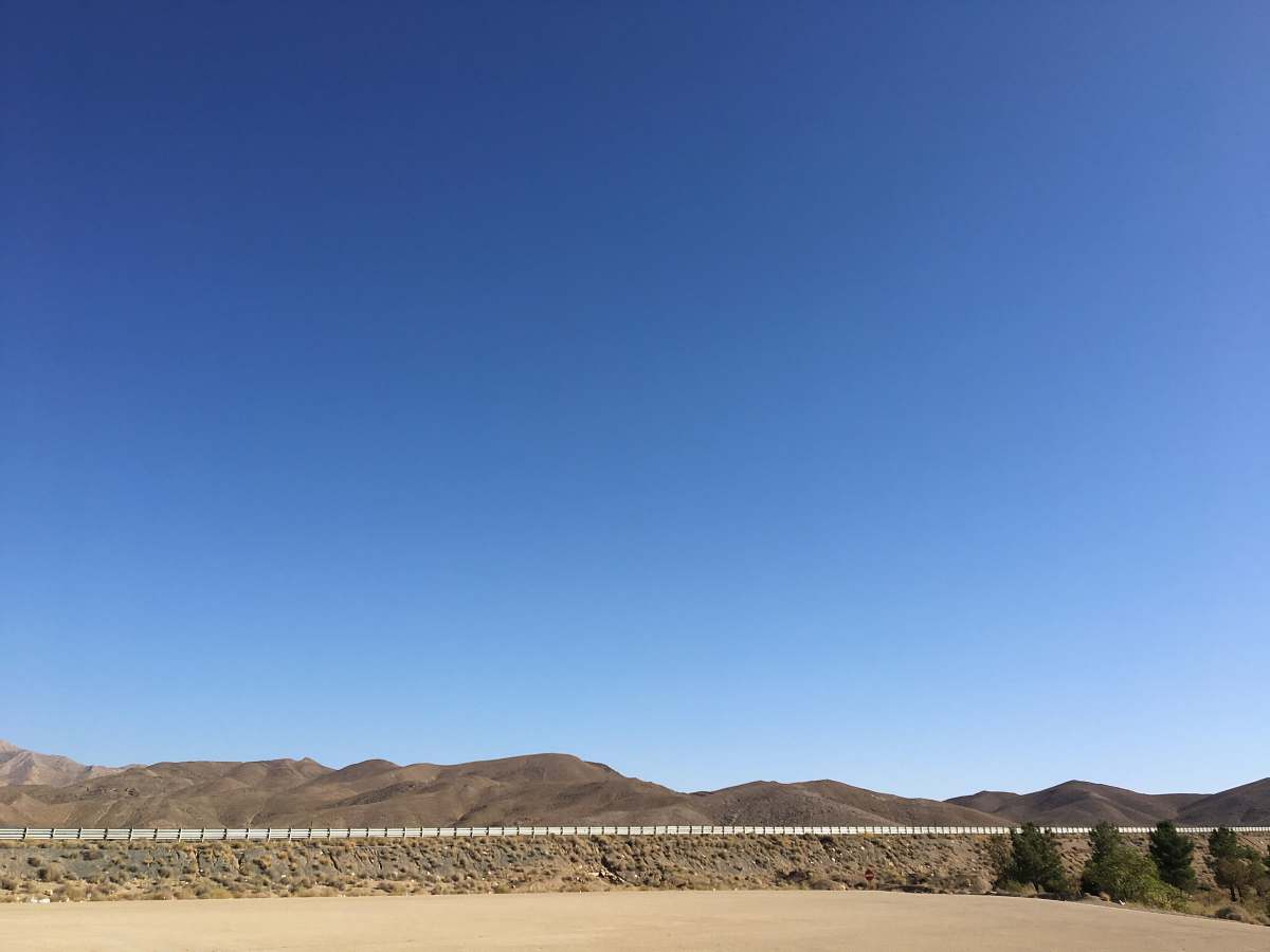 nature grey mountain under blue sky soil