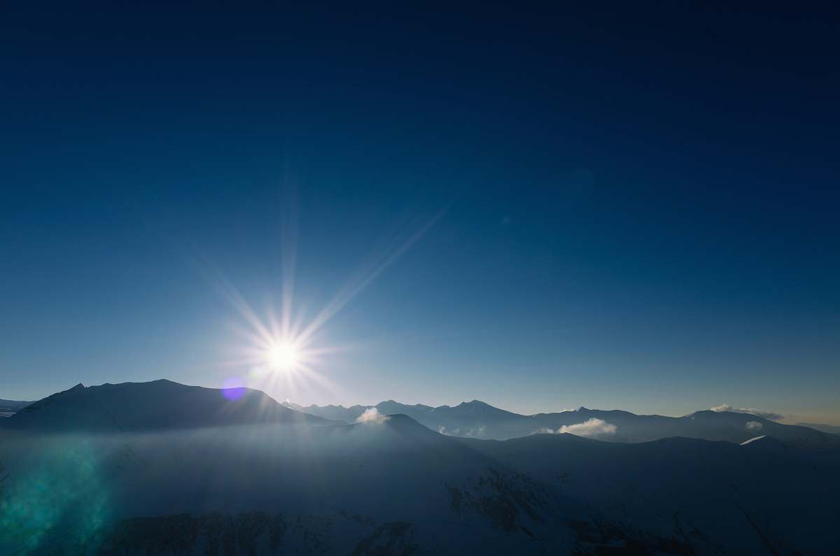 mountains bird's-eye view photography of mountain under clear blue sky mountain