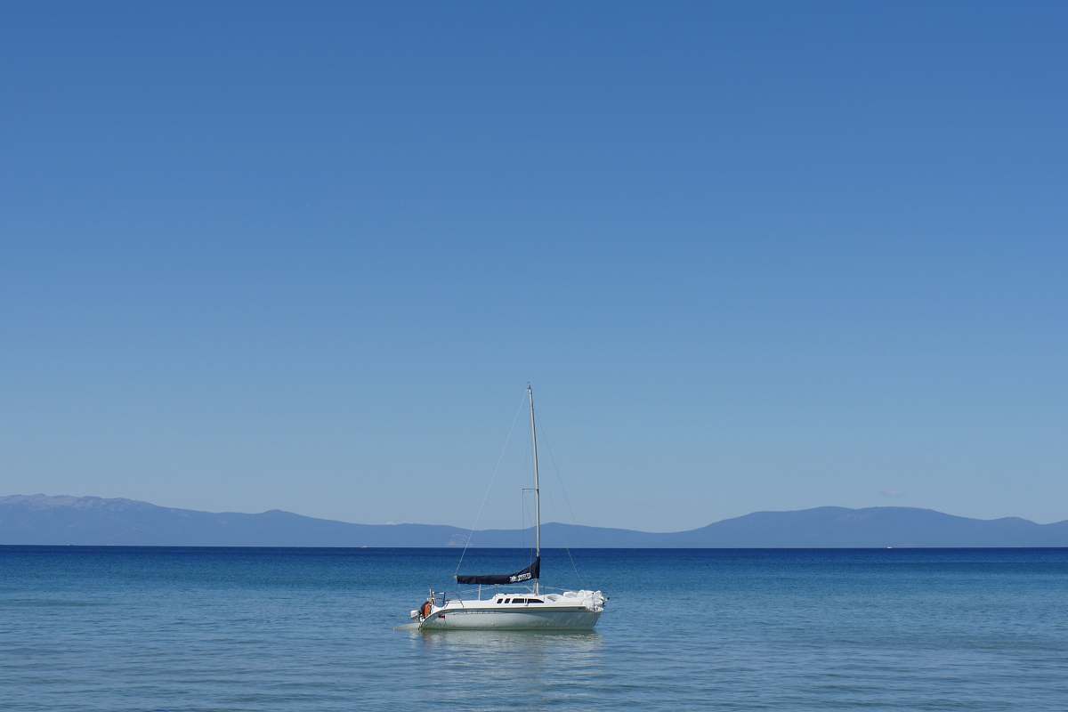 boat sail boat on body of water during daytime vehicle