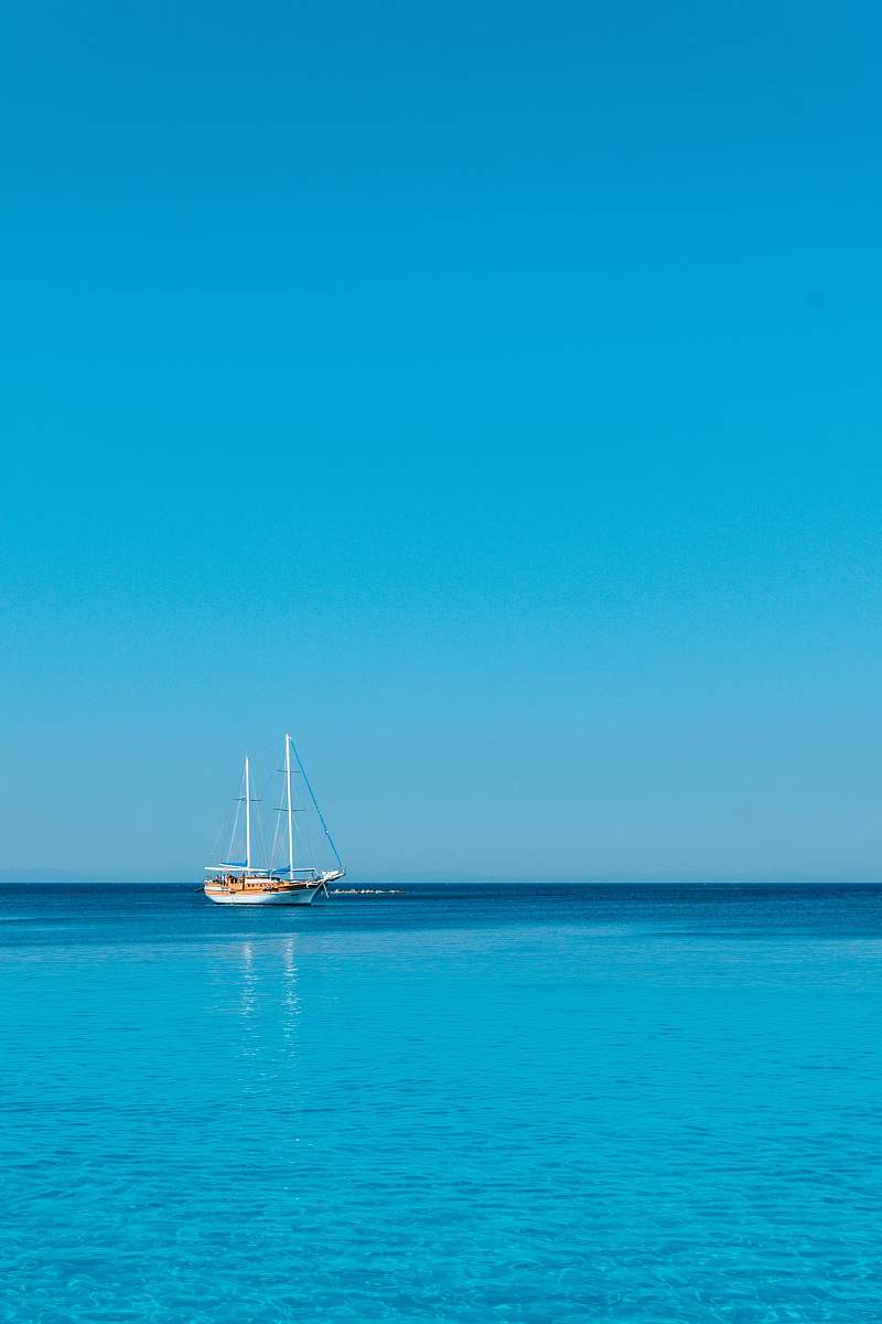 vehicle white and brown boat on body of water at daytime vessel