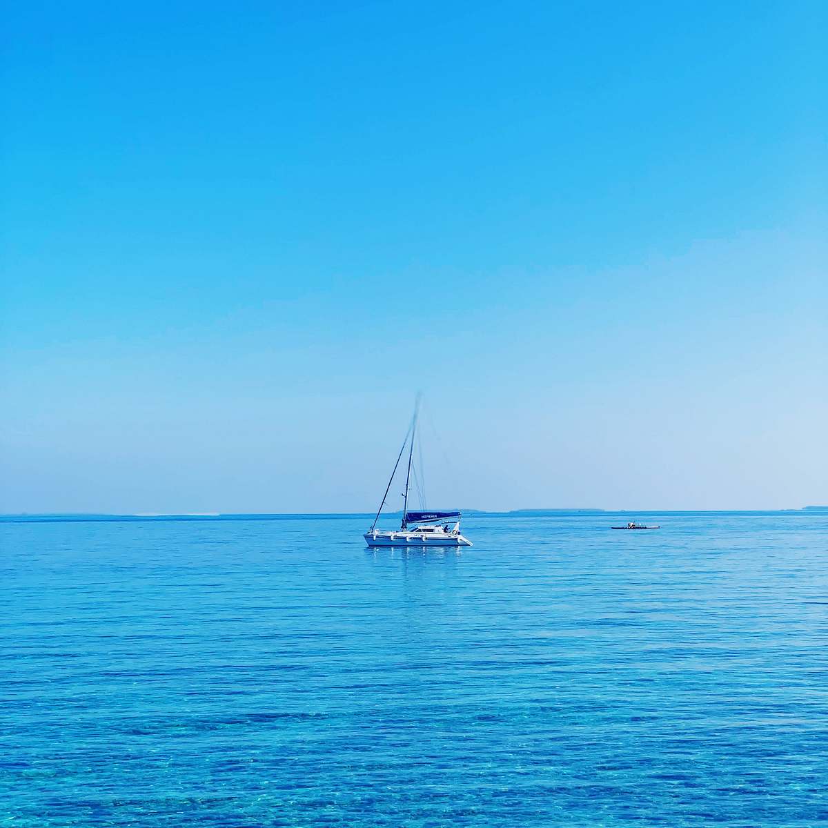 transportation white and blue boat on body of water at daytime boat
