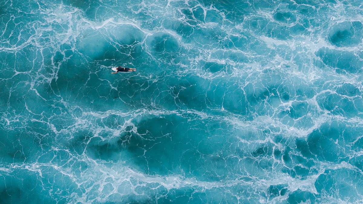 nature aerial photography of surfer on body of water ocean