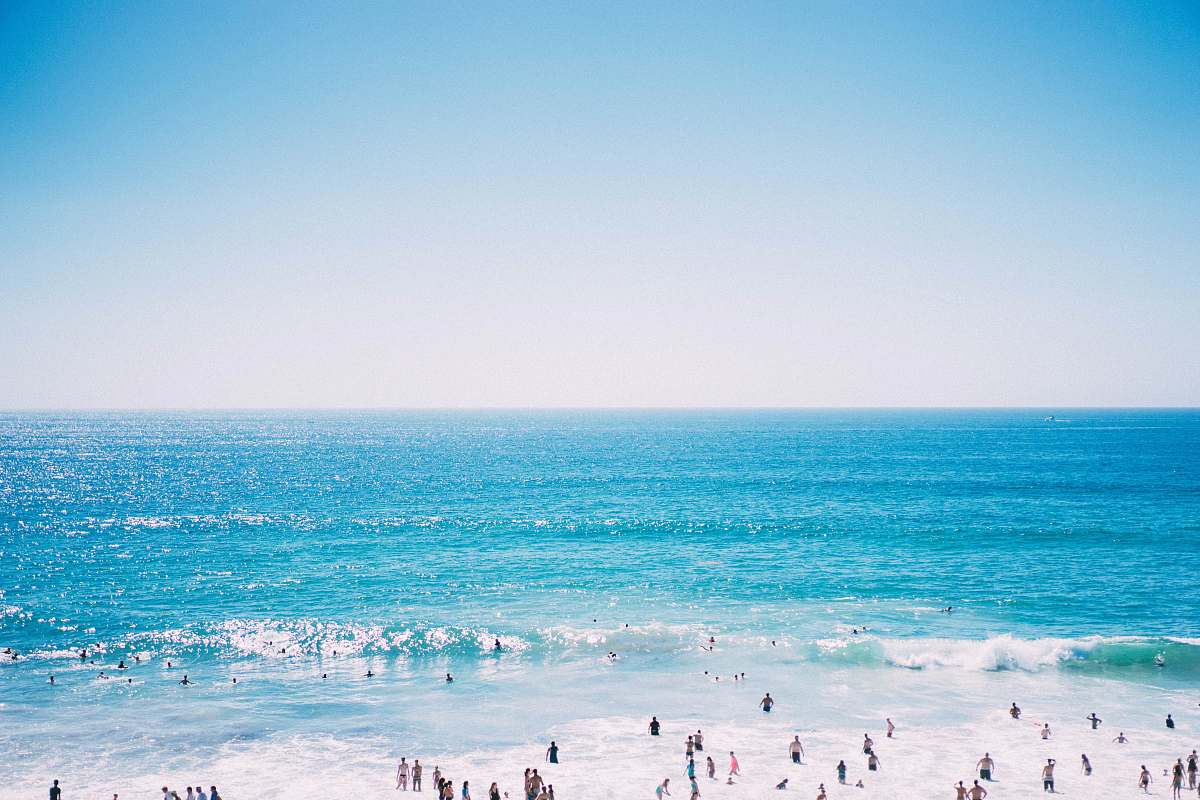 ocean bird's eye view of people on sea beach