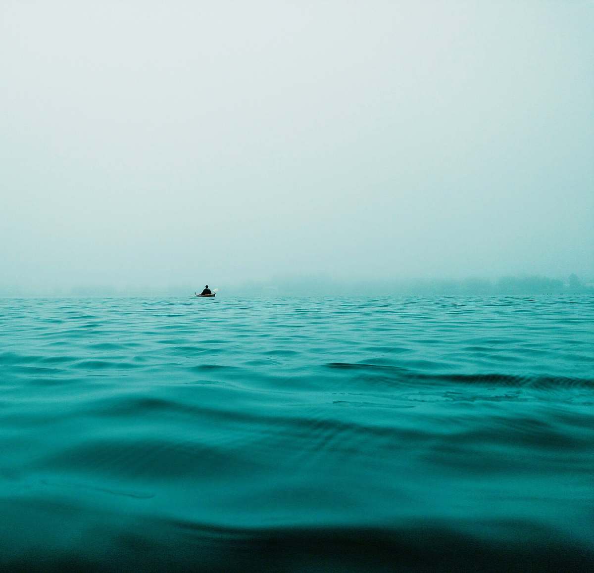 ocean closeup photo of calm body of water horizon