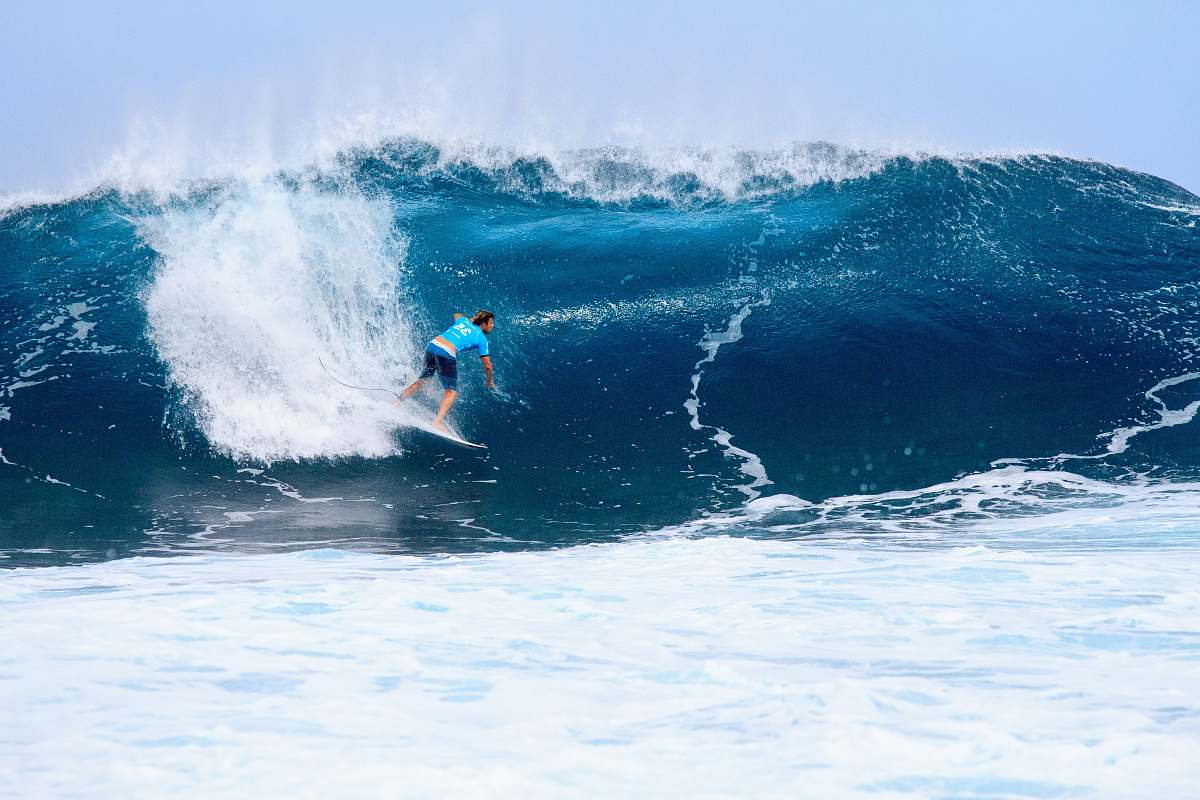ocean surfer surfing on tidal wave sea