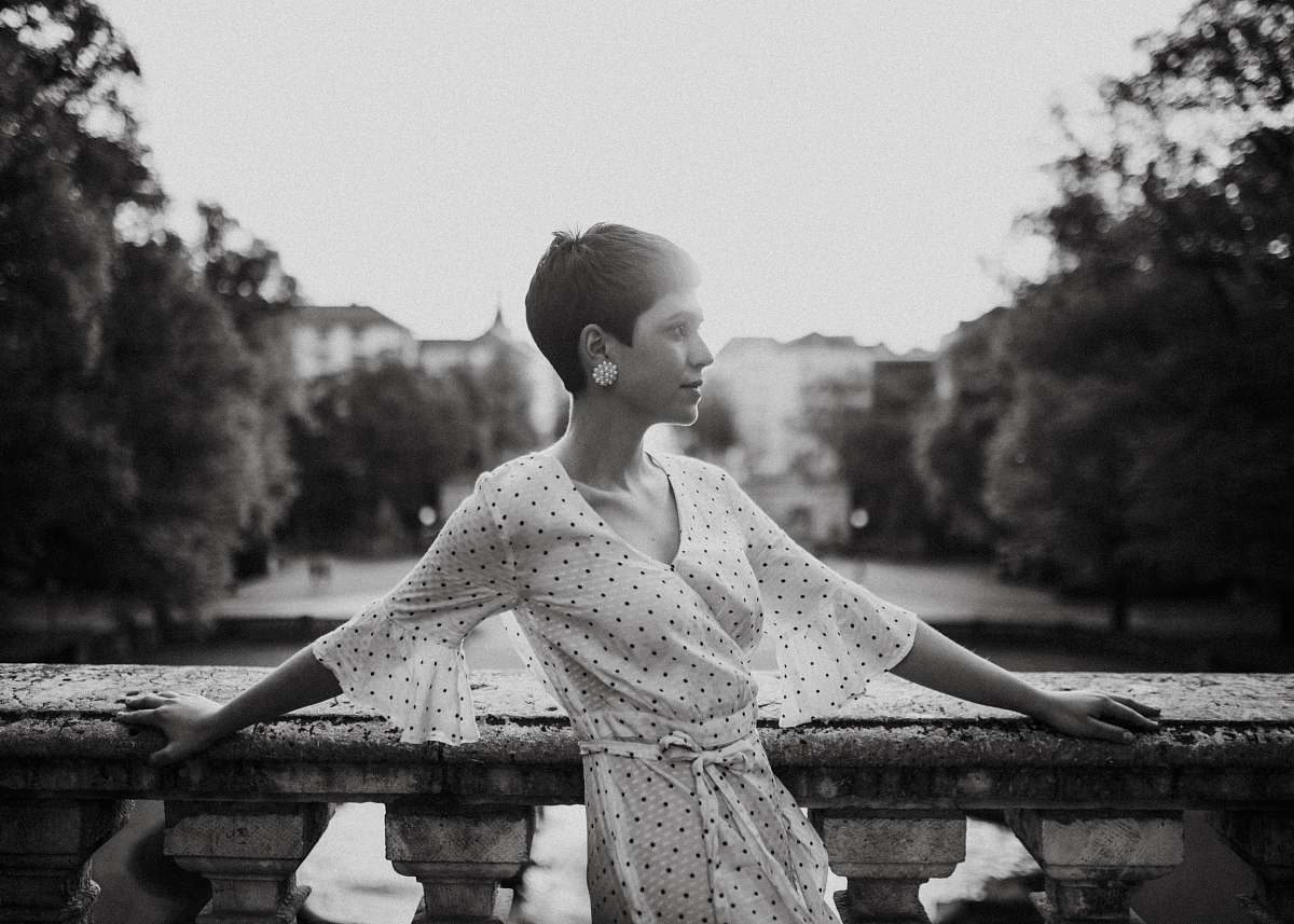 munich woman leaning on concrete fence germany
