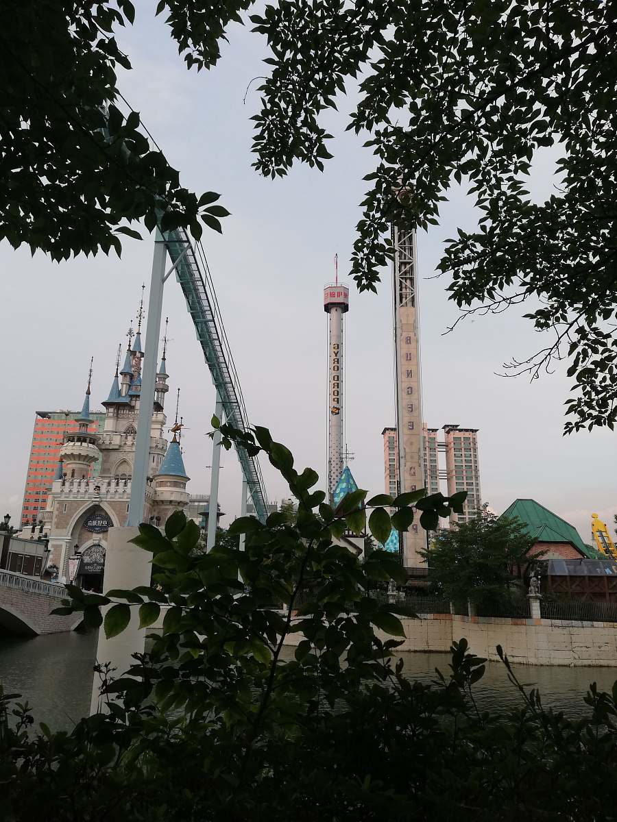 architecture grey and brown concrete buildings during daytime spire