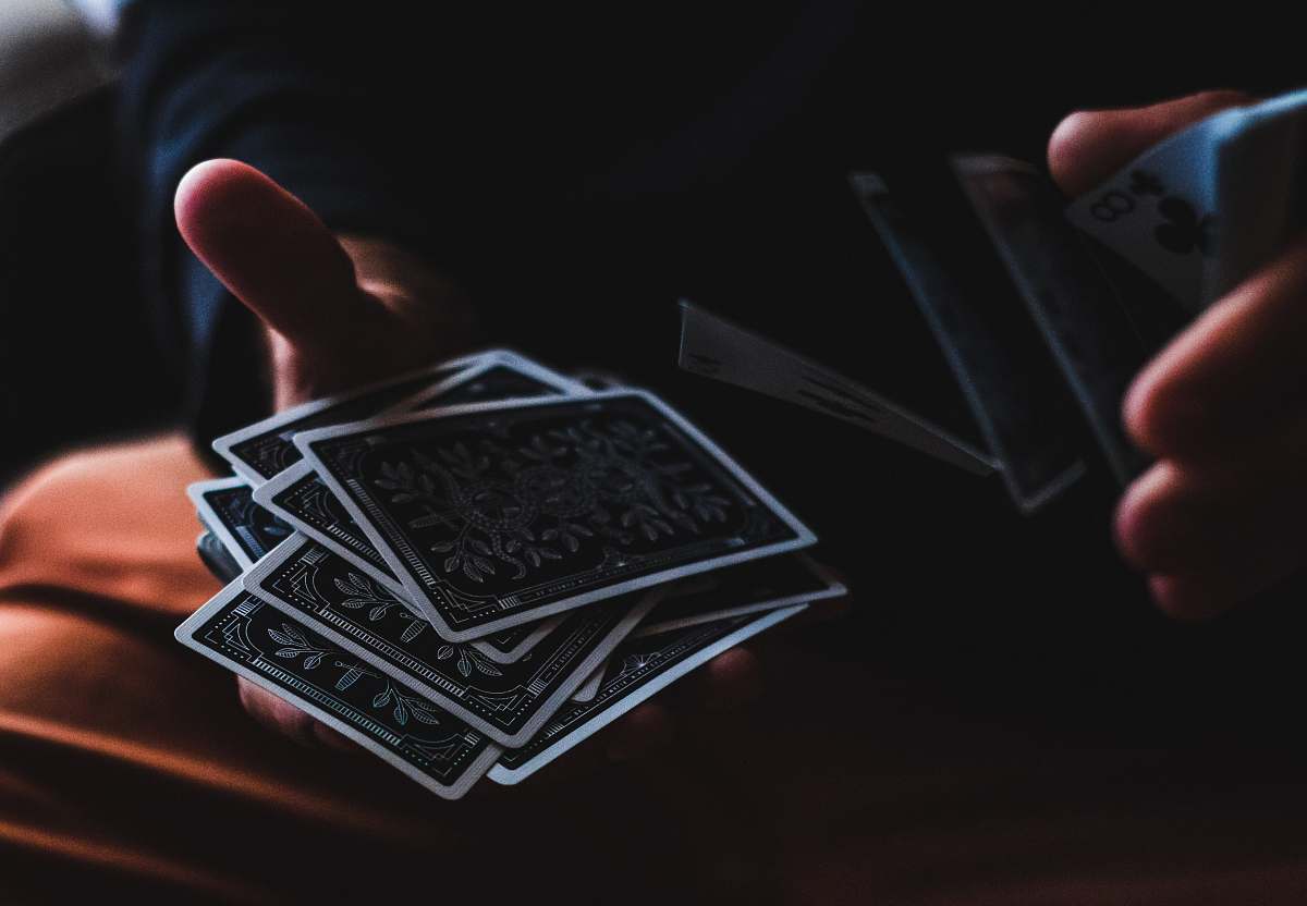 game person playing with cards hand