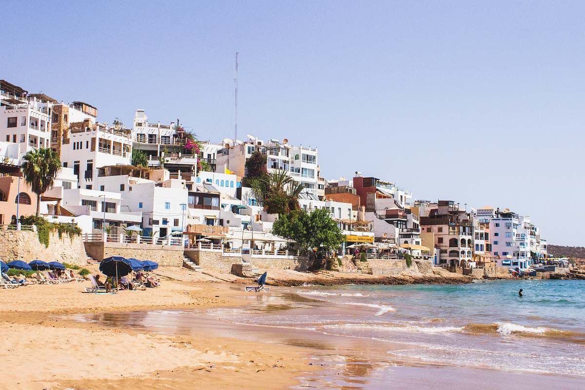 beach white building near sea during daytime sea