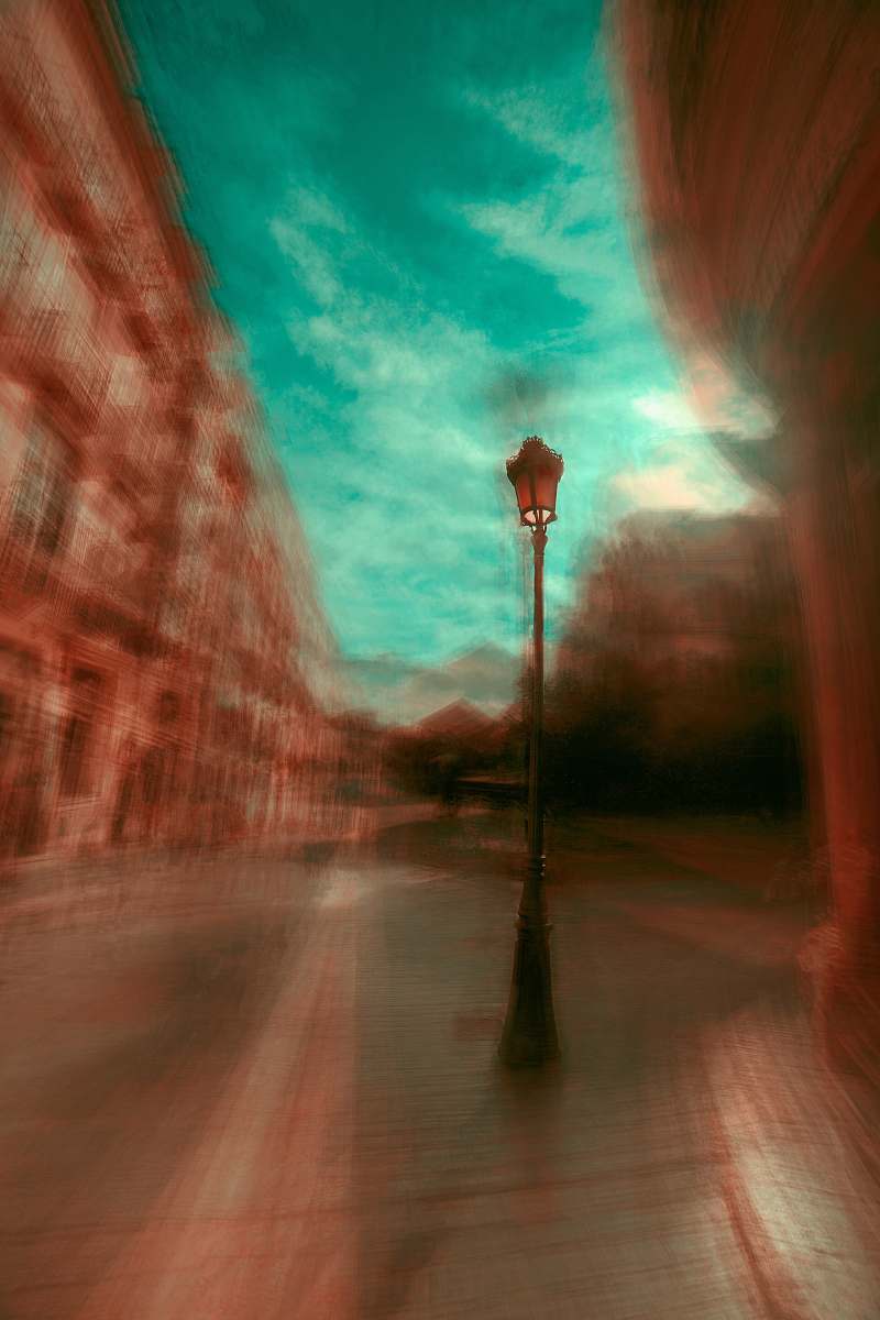 layers black street post lamp beside wall magician
