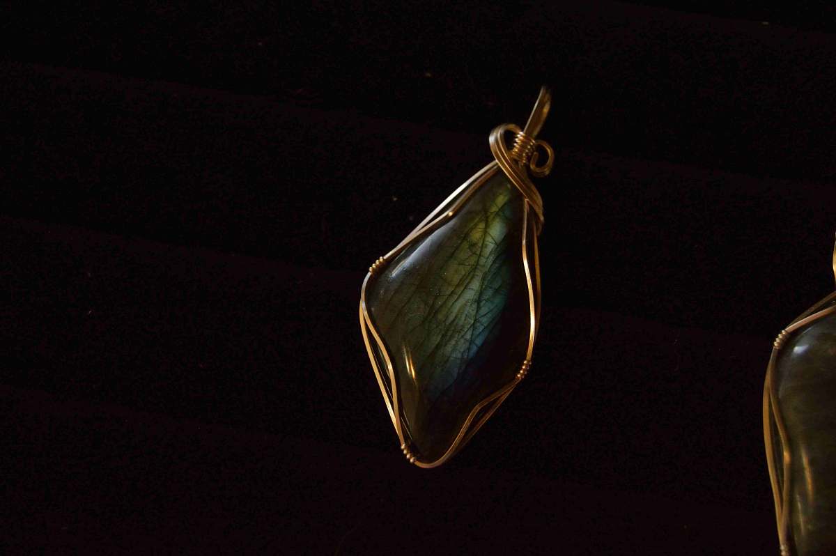 jewelry green gemstone wire wrap pendant with black background jewellery