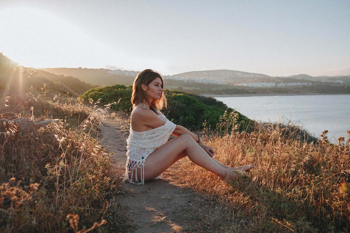 apparel woman sitting near river clothing