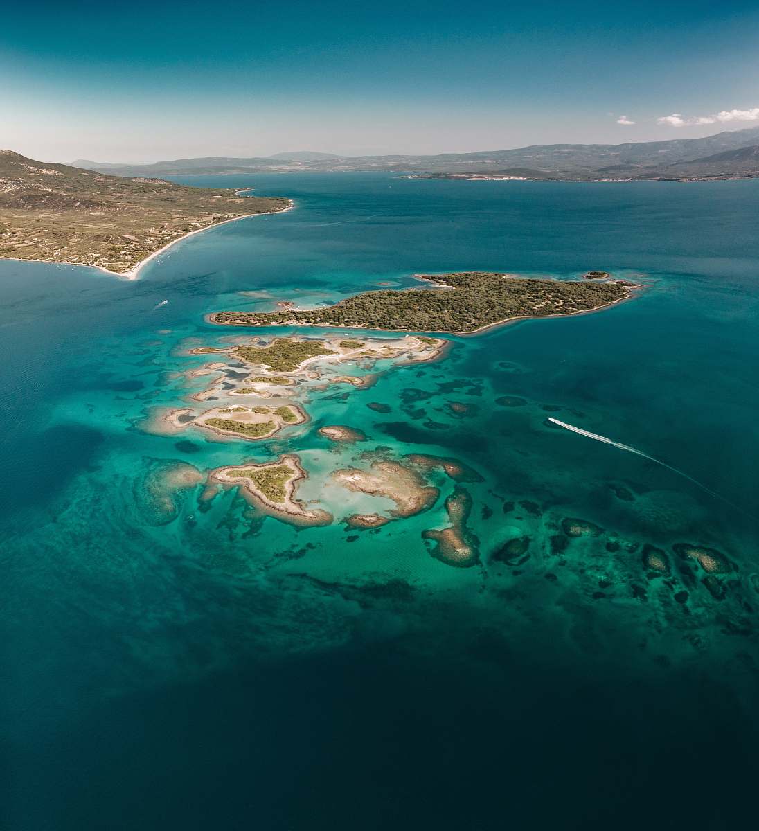 outdoors aerial photography of island near other islands landscape