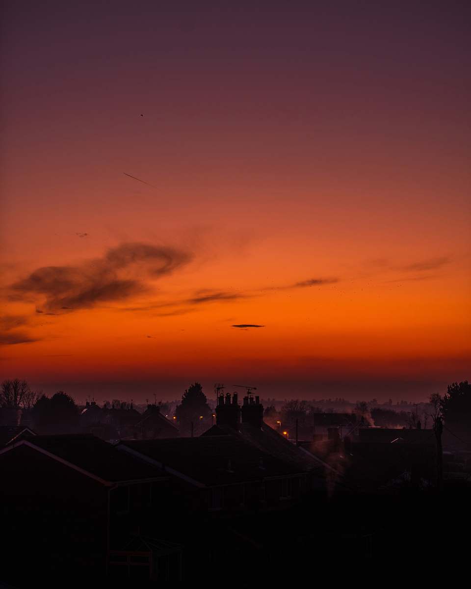 sky city under cloudy sky during golden hour sunset
