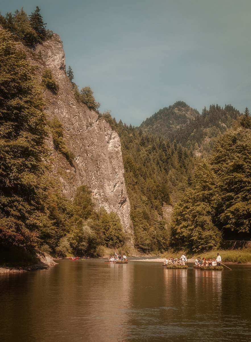 outdoors people in boats on lake viewing mountain during daytime human