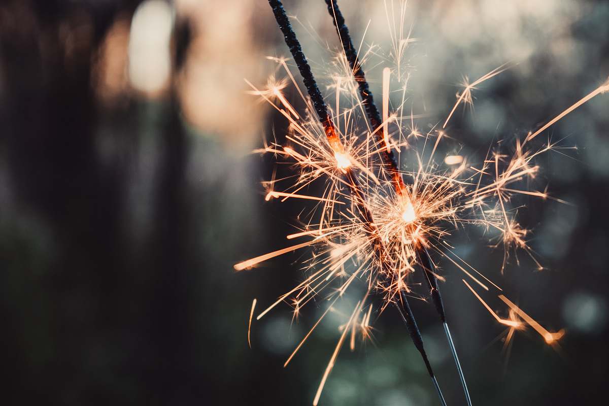 outdoors selective focus photo of sparkle stick night