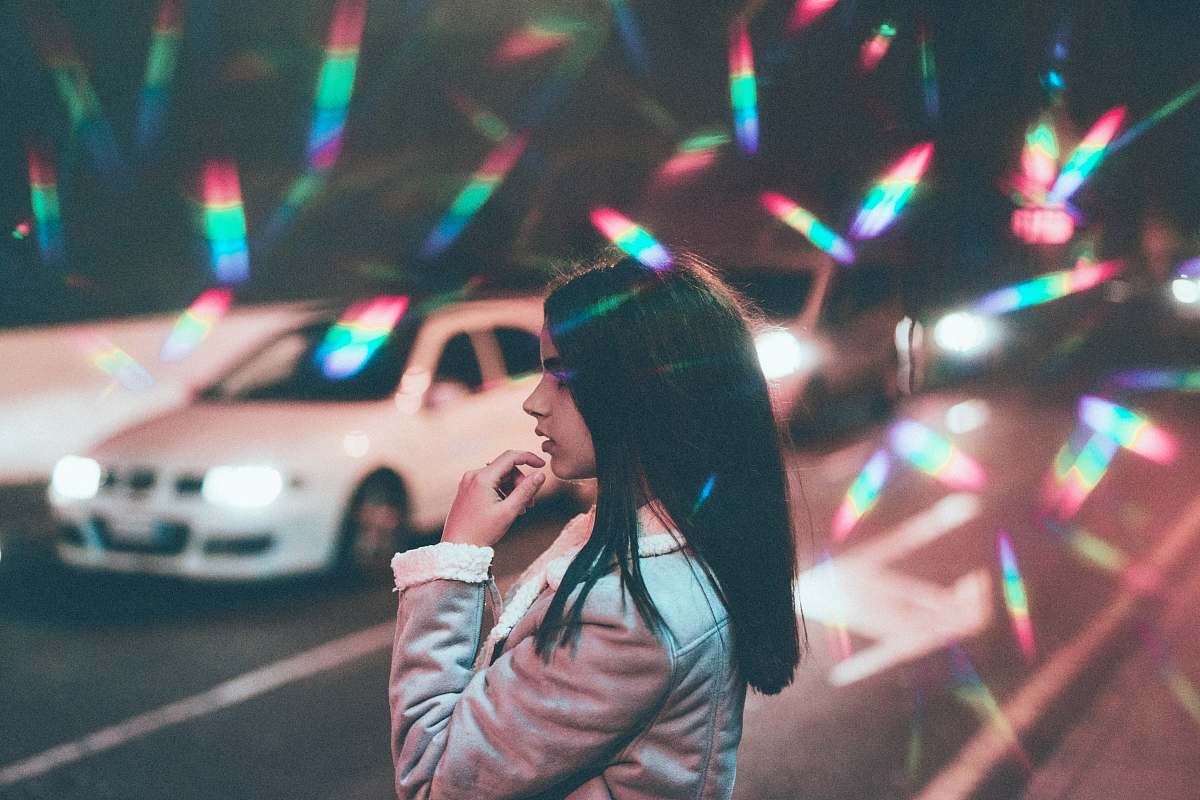human girl standing near white car on road person