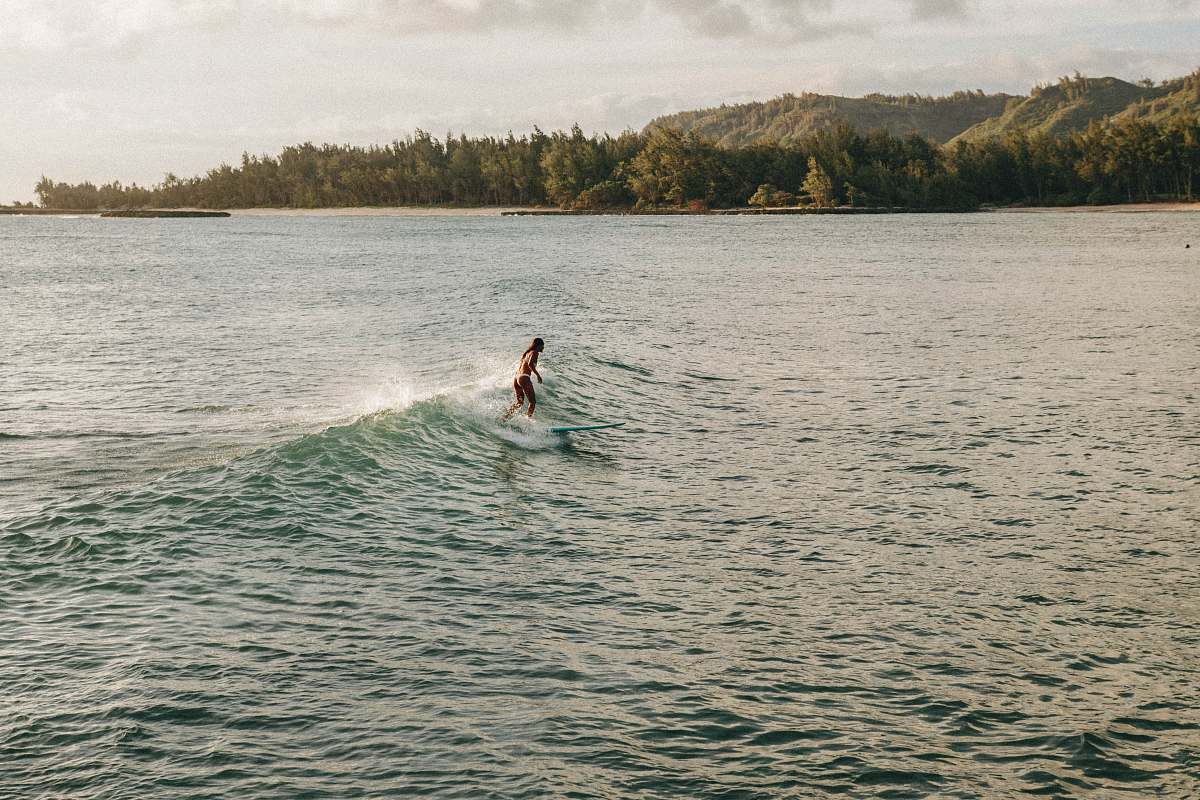 sea woman surfing during daytime wave