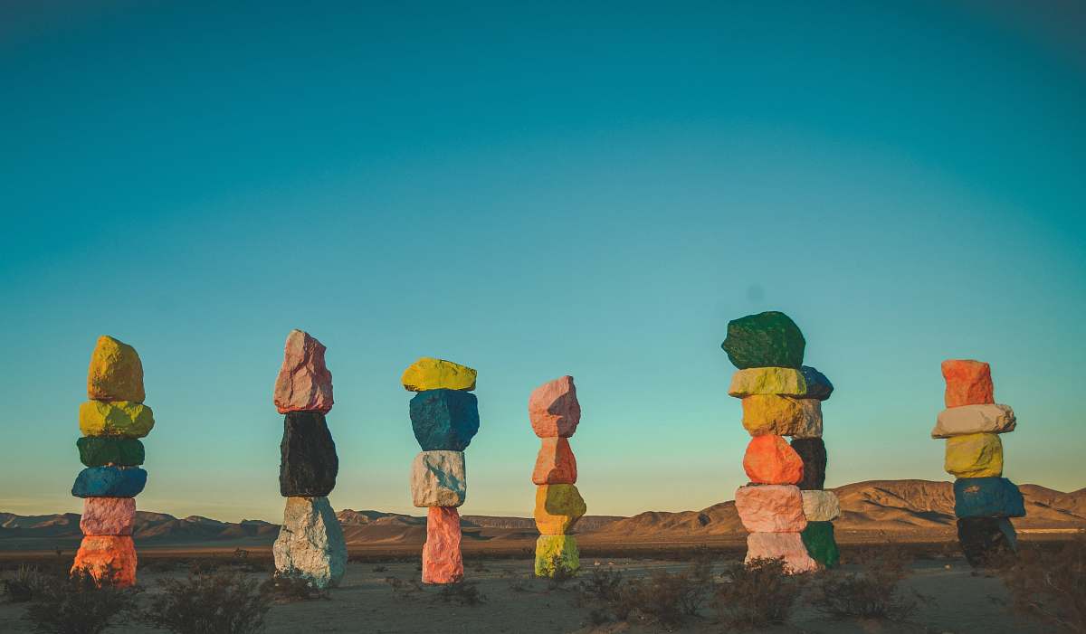 nature assorted-colored stacked stones photo seven magic mountains