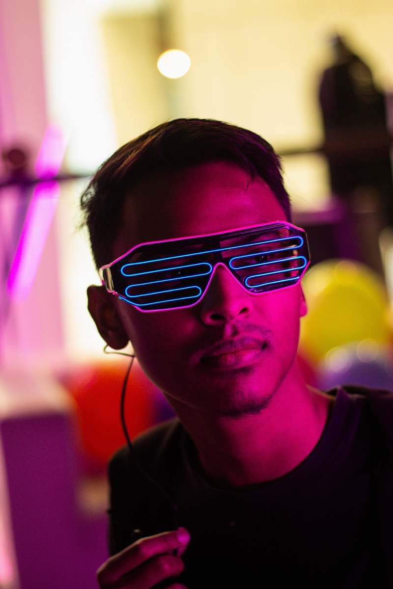human man in black crew neck shirt and LED sunglasses sunglasses