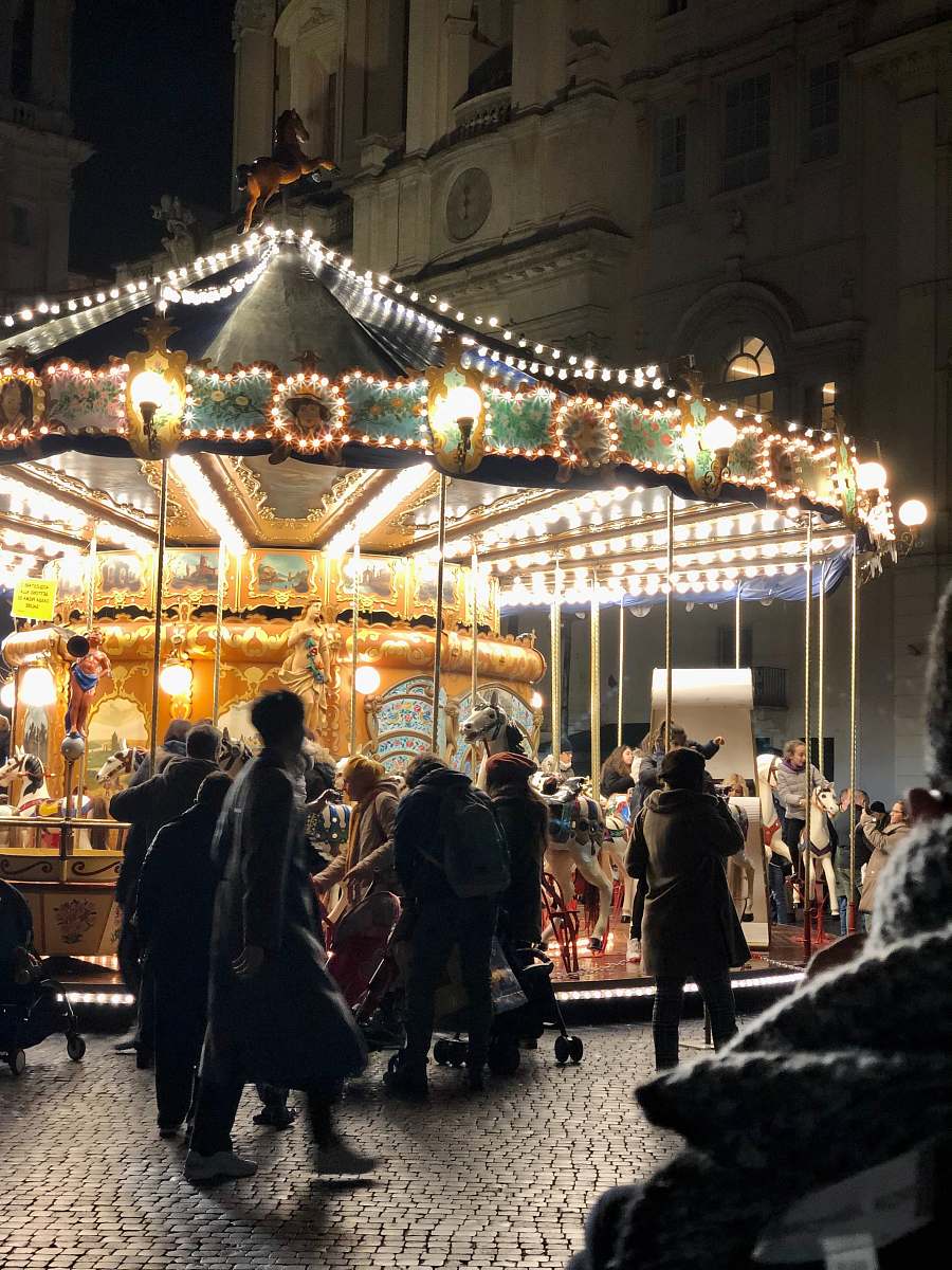 human people near horse carousel carousel
