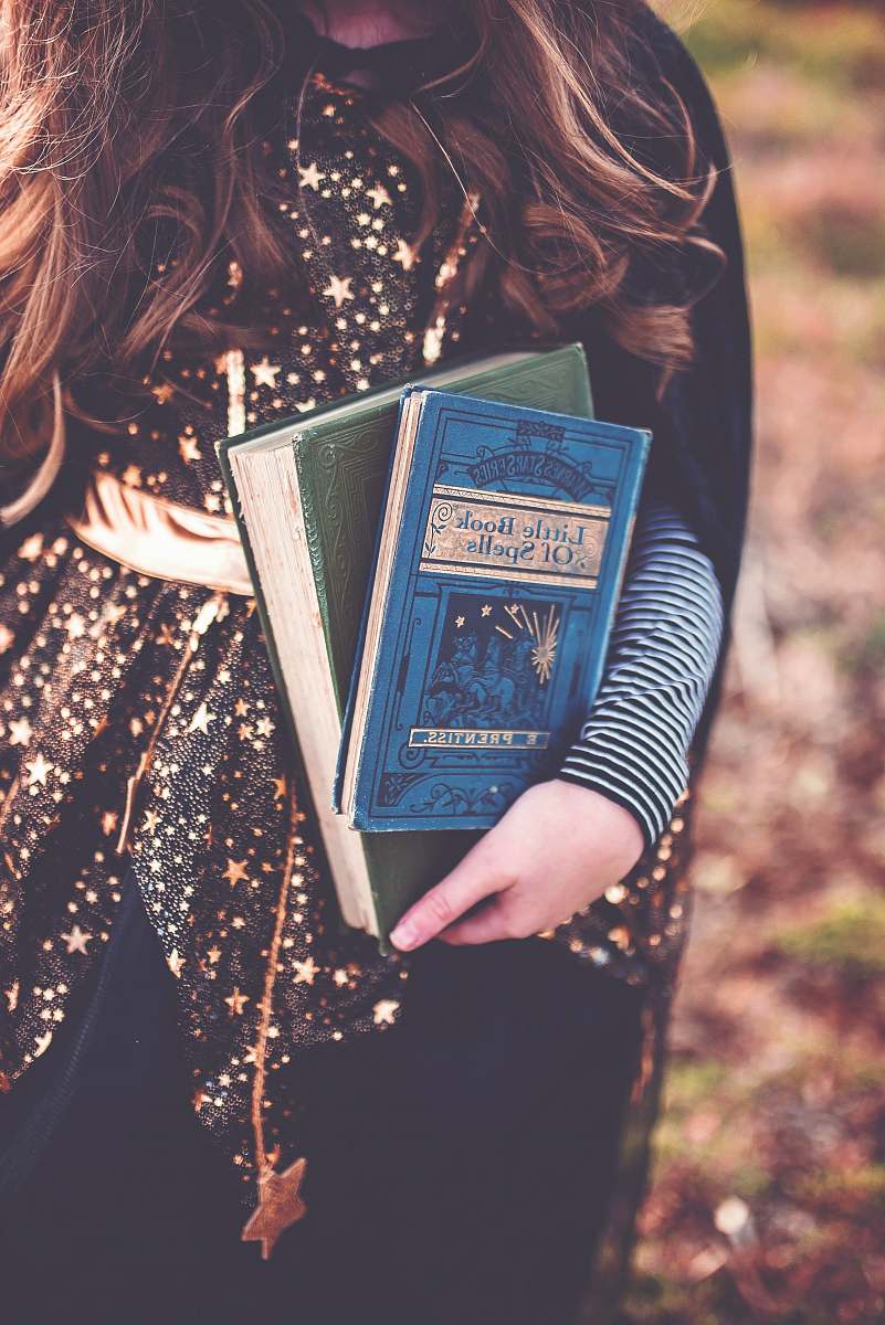 people person holding two books human