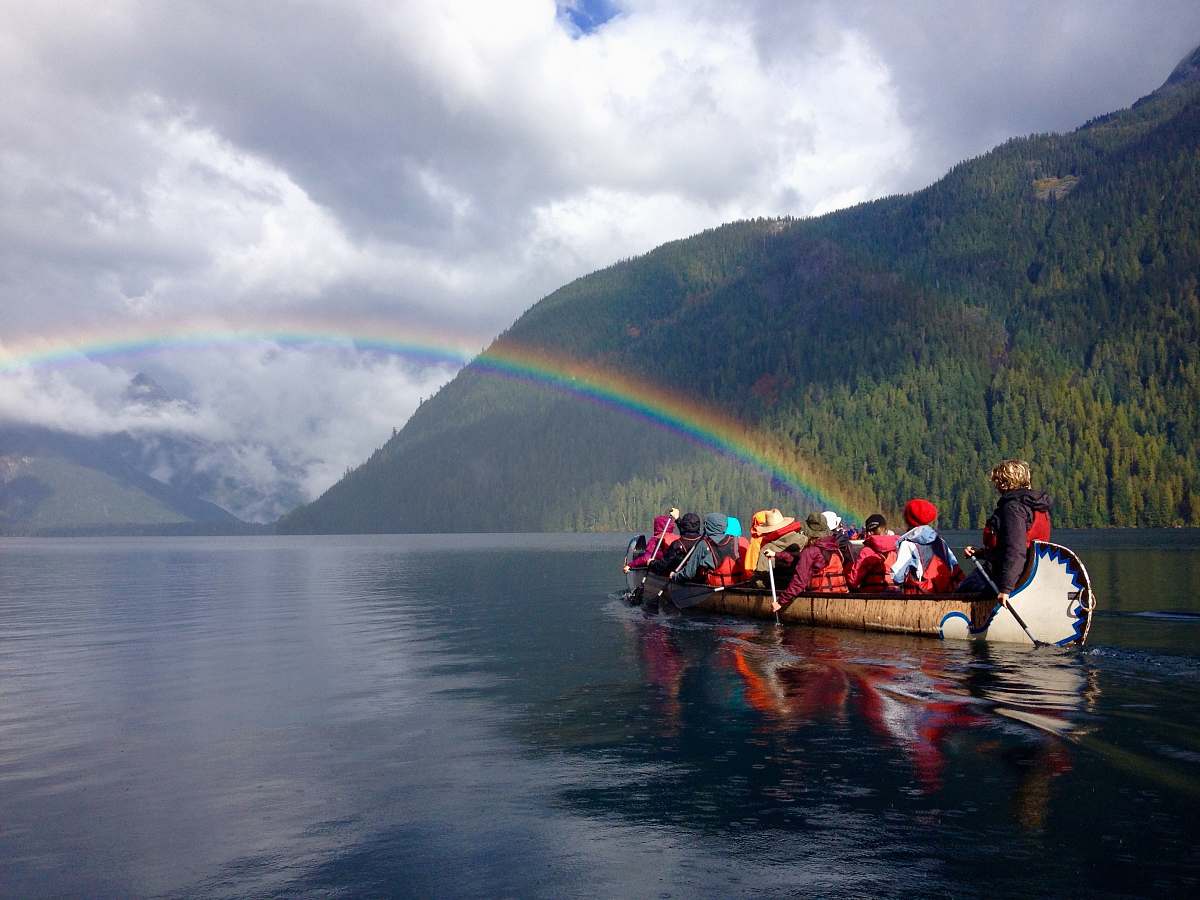 human photography of people riding brown boat during daytime boat