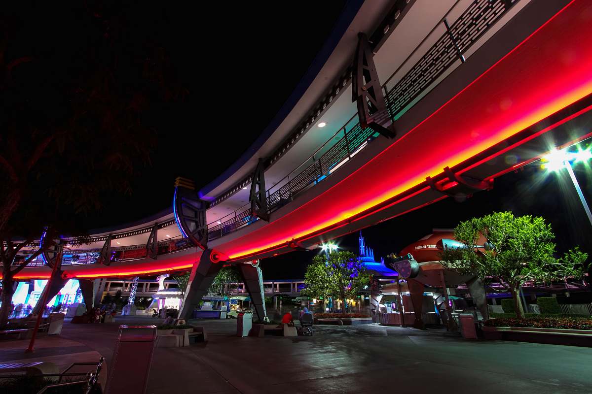 human red neon lights lining the building magic kingdom