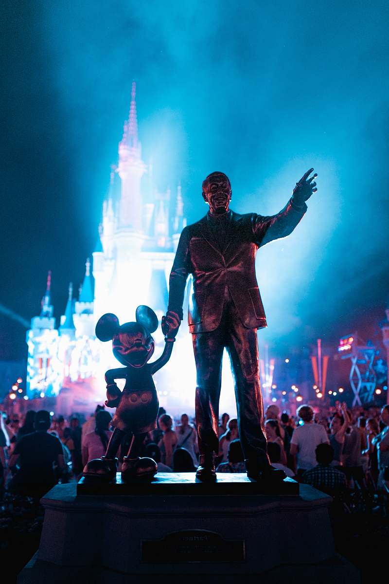 people Walt Disney and Mickey Mouse statue during daytime human