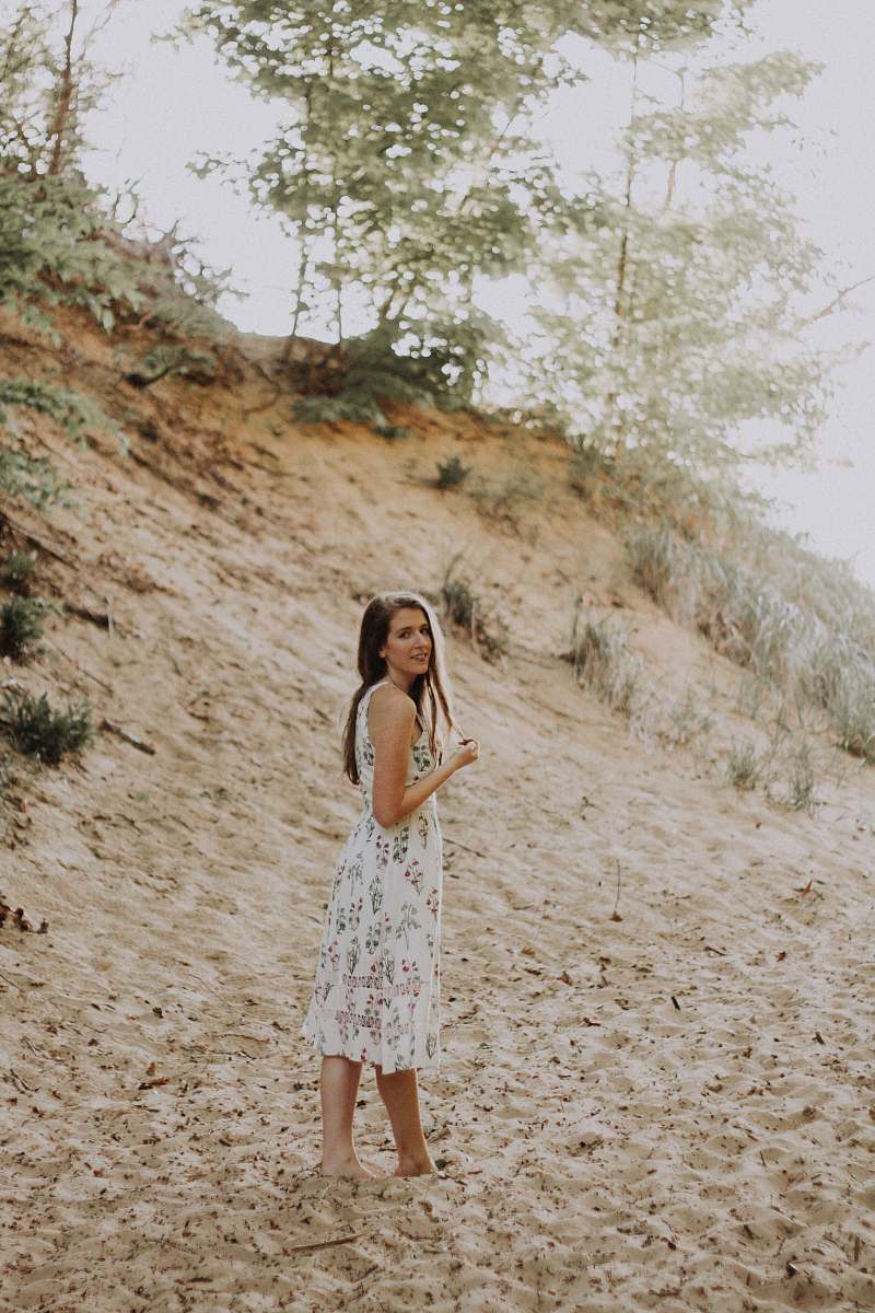 female woman on sand wearing dress portrait