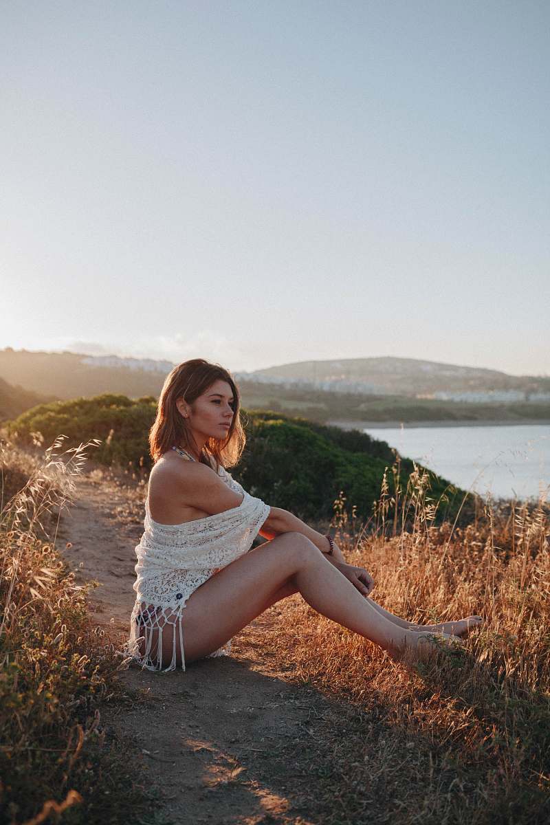 apparel woman sitting near river clothing