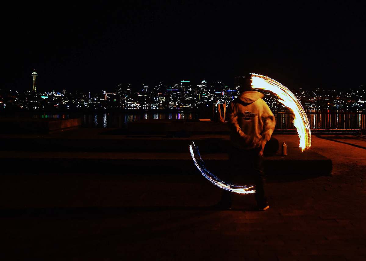 fire man performing fire dance gas works park