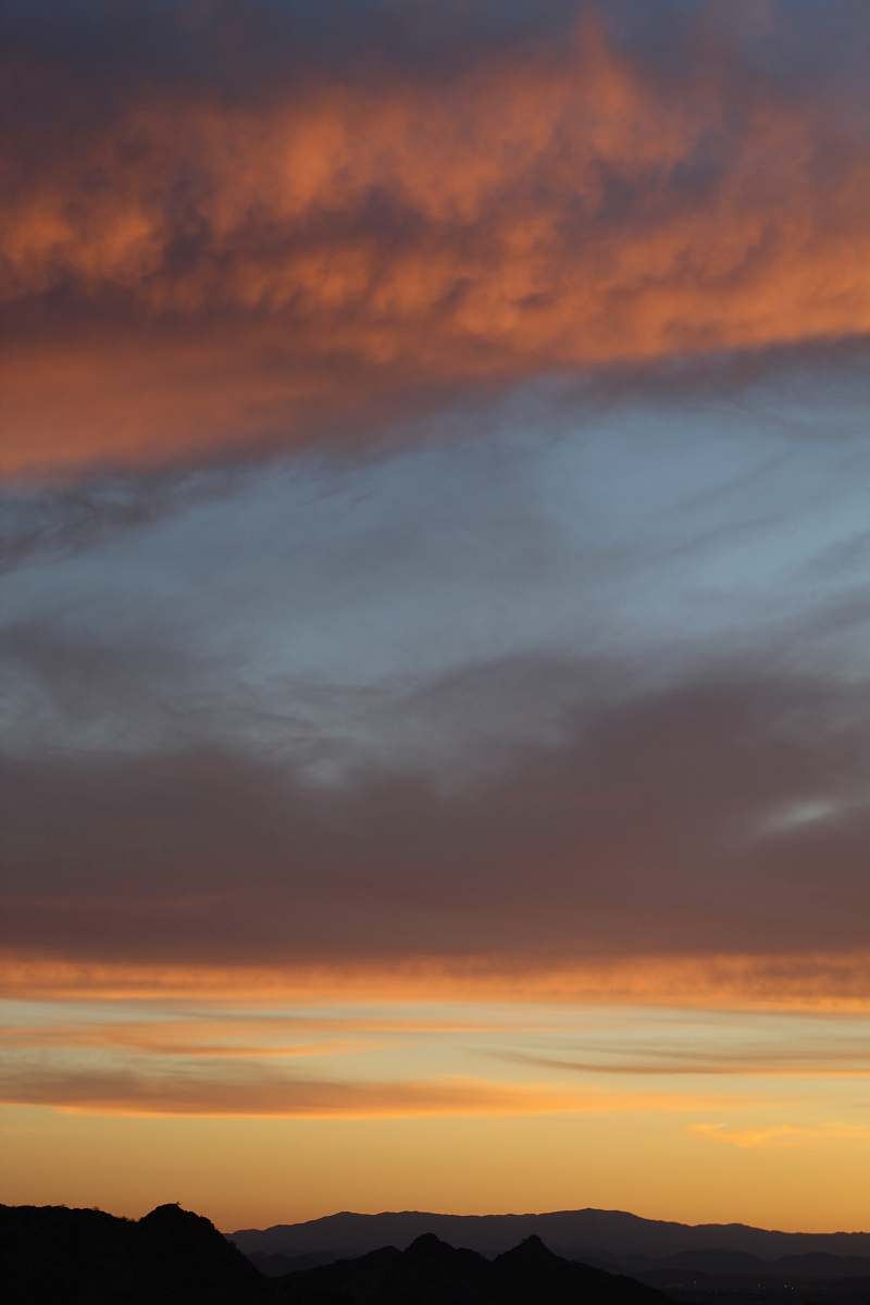sunset cloudy sky over mountains dawn