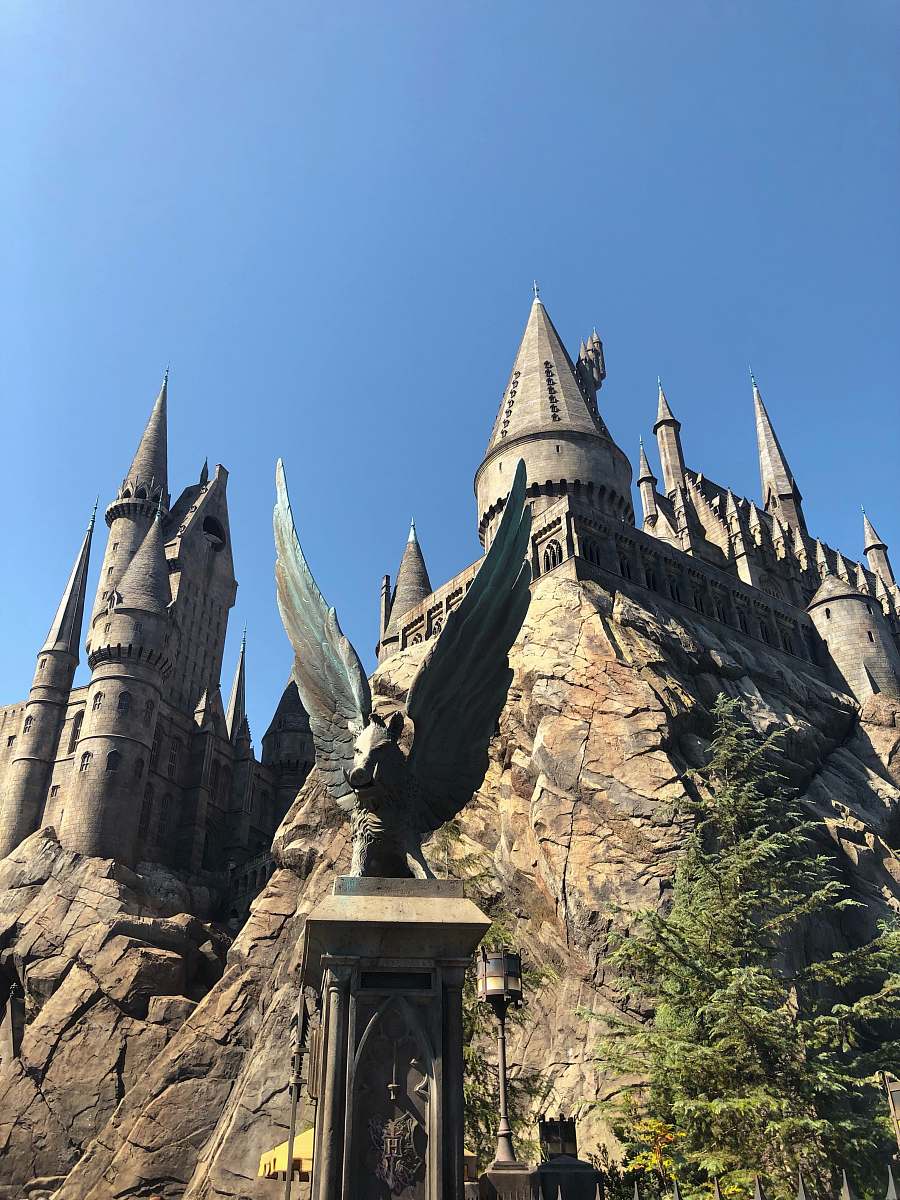 steeple grey concrete castle during daytime spire