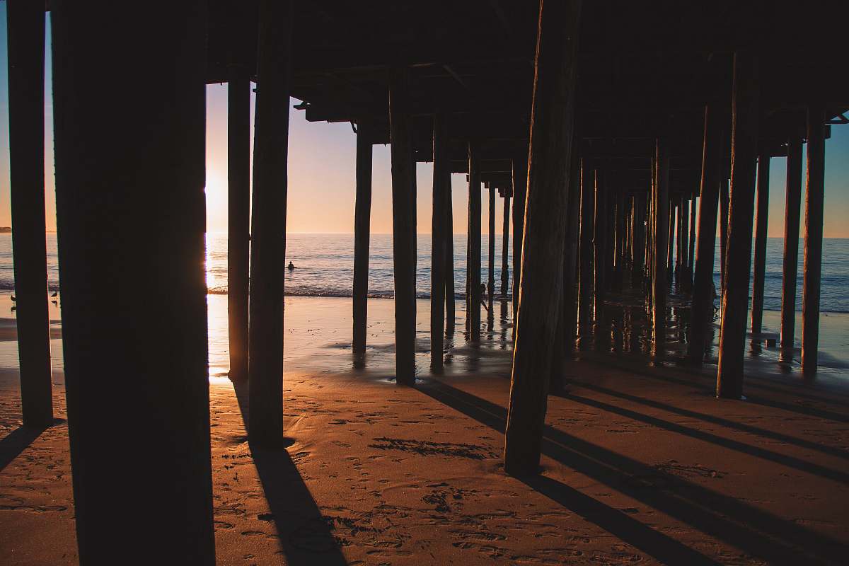 pier silhouette photo of sea dock dock