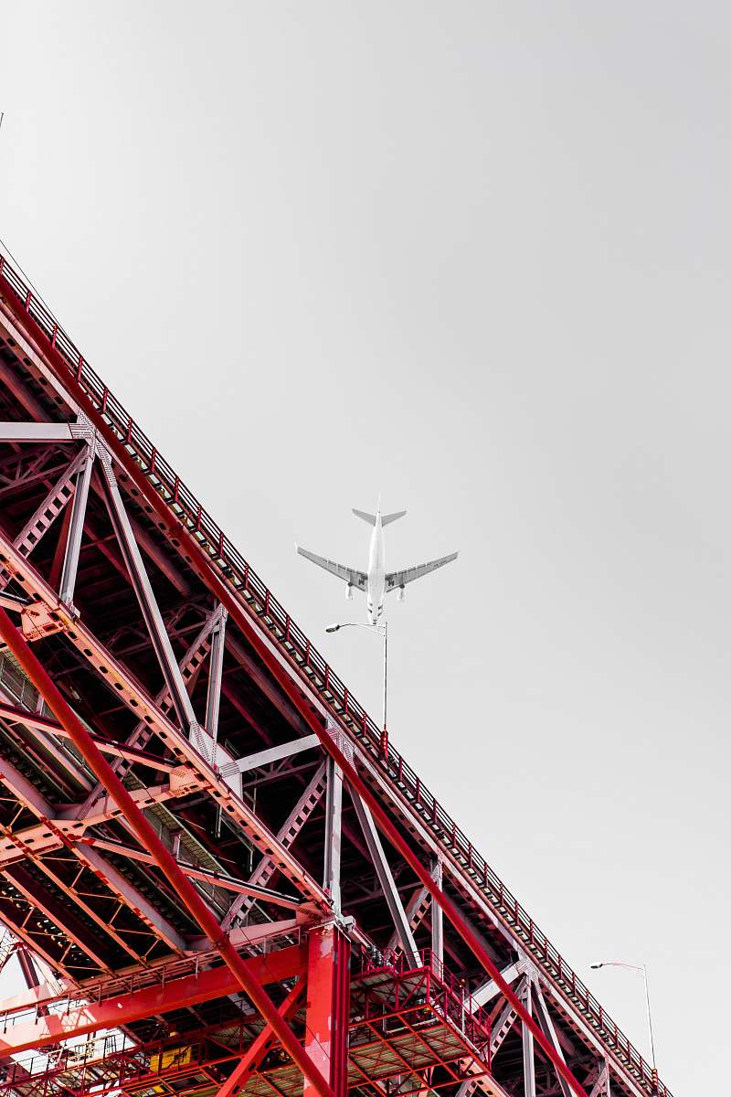 bridge low angle photography of transportation plane above the bridge lisbon