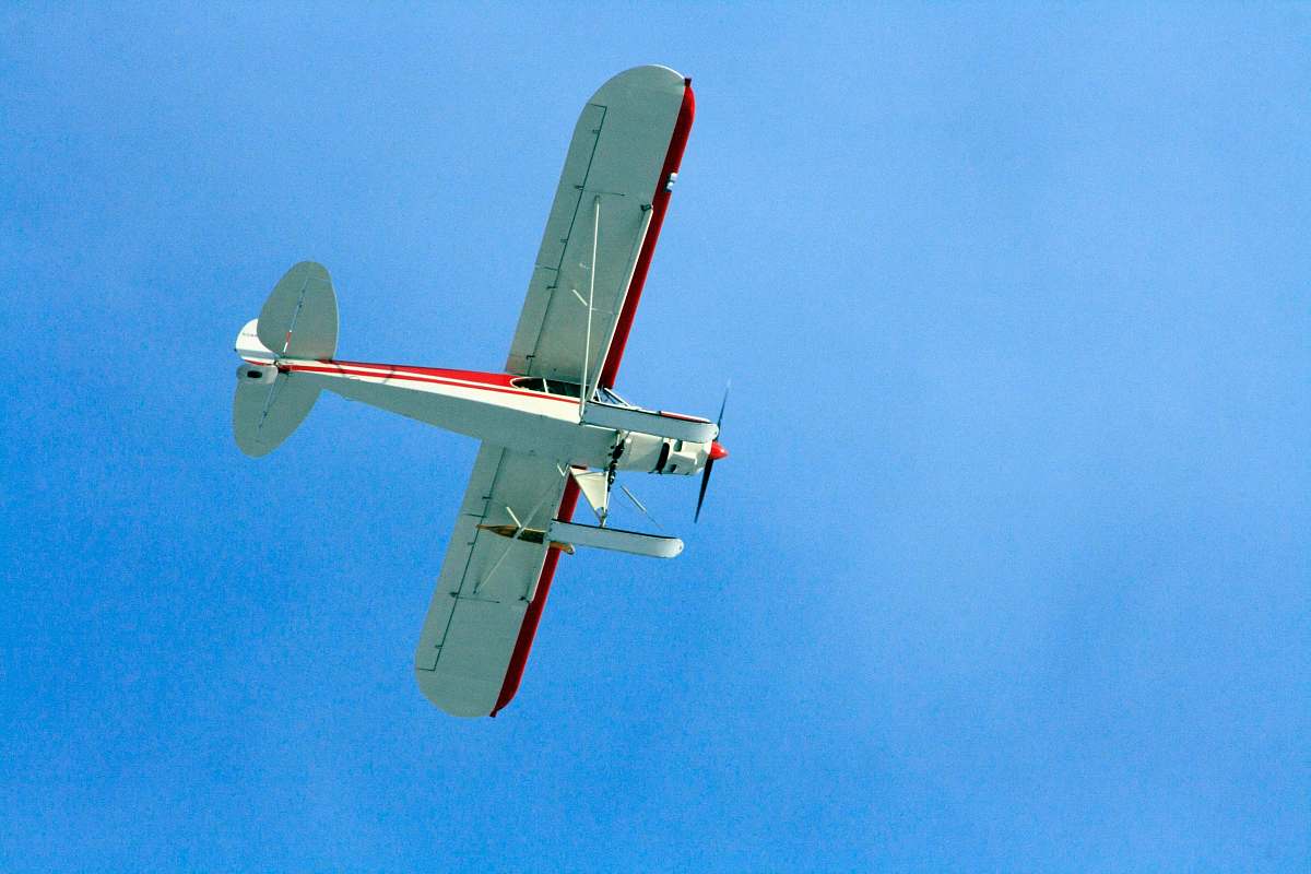 aircraft plane flying through the sky biplane