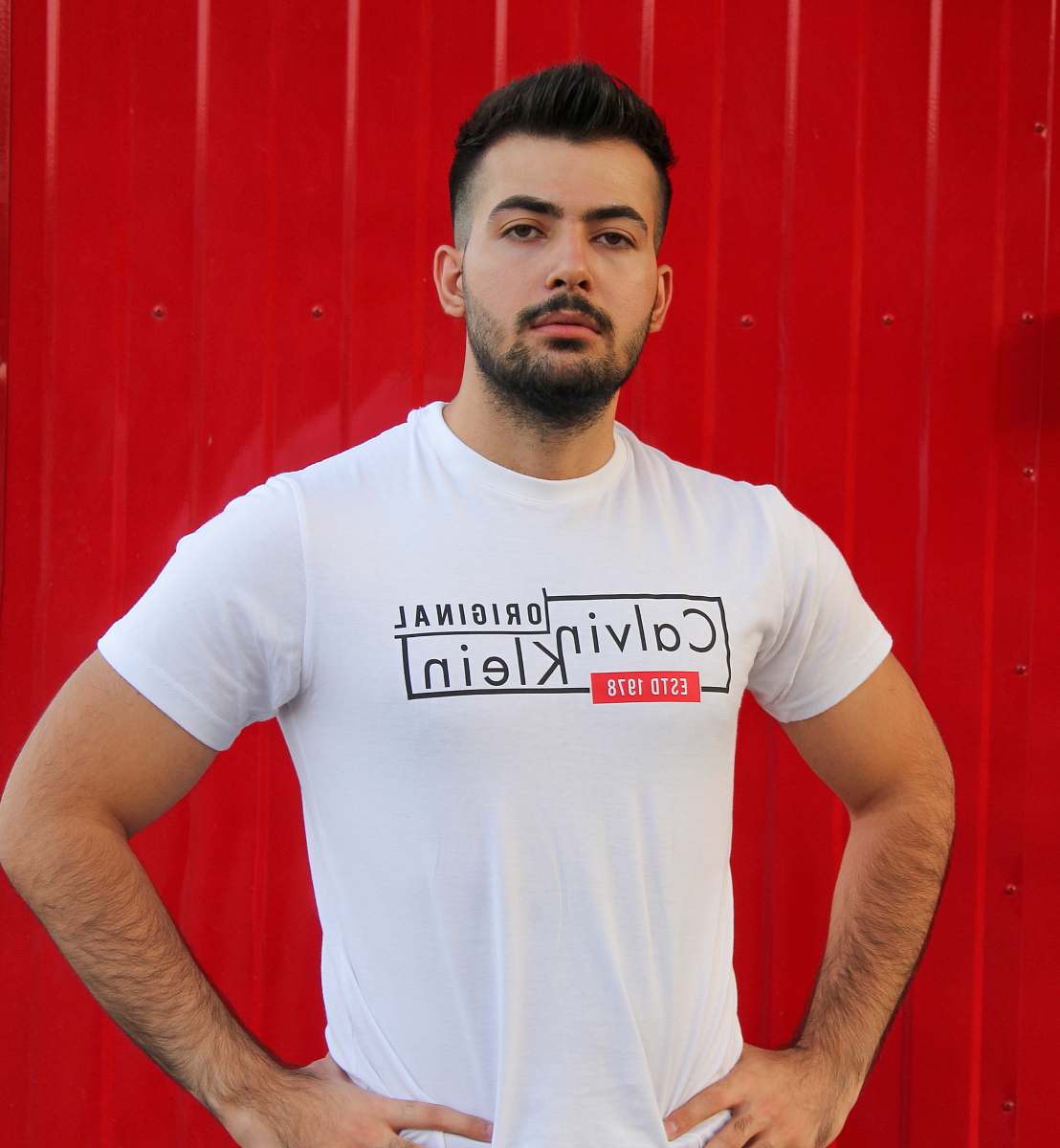 clothing man wearing white Calvin Klein crew-neck t-shirt sleeve