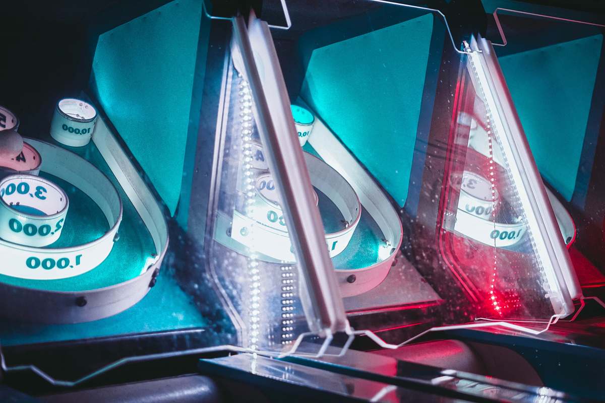 blue photo of arcade machine green