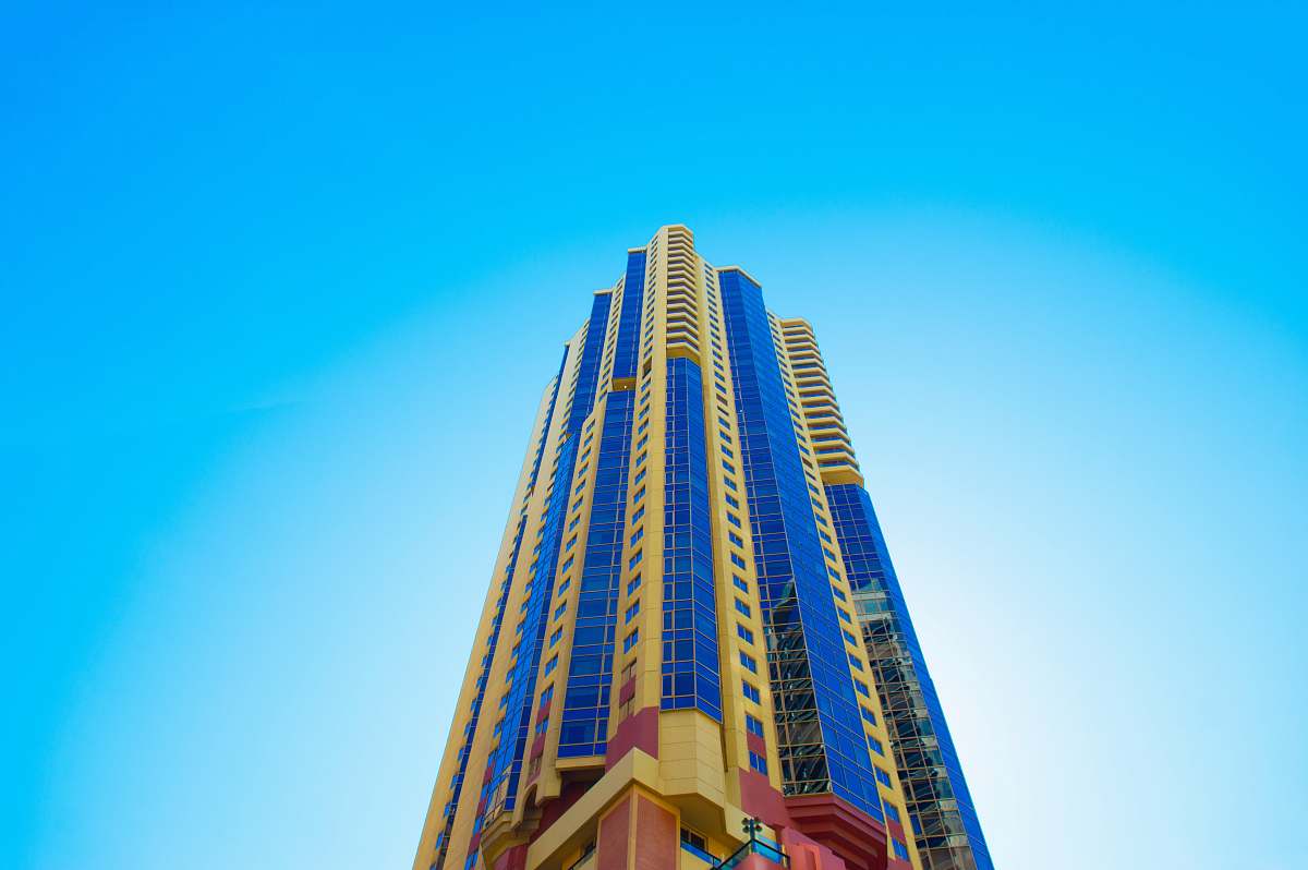 sky blue and beige high-rise building skyscraper