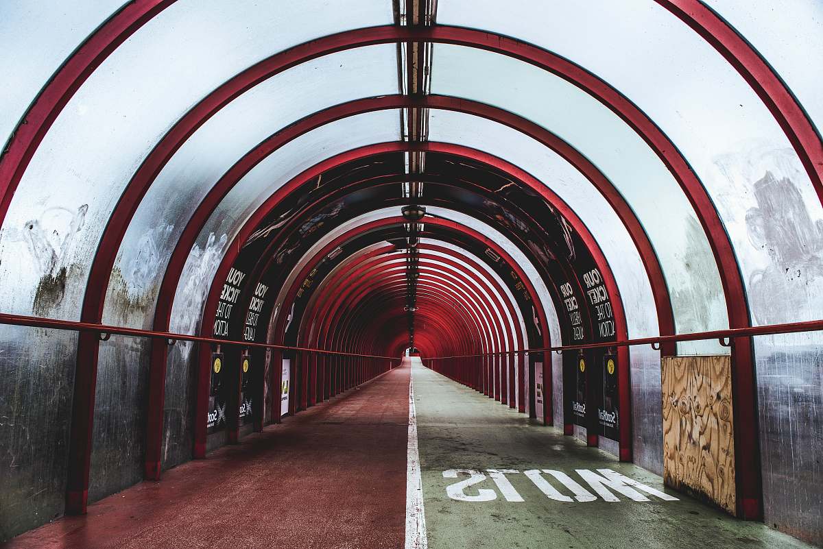 glasgow empty red and white glass tunnel building