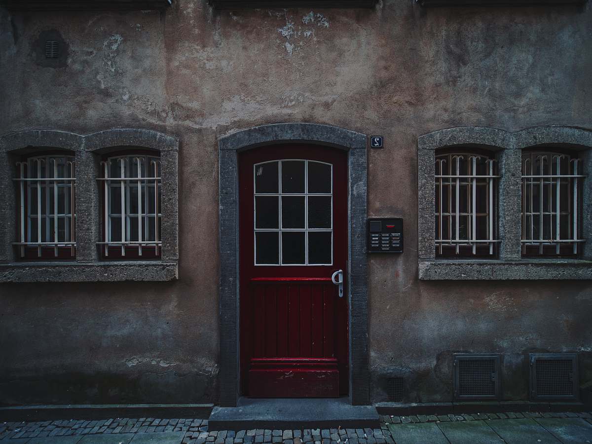 building red wooden half-glass closed door door