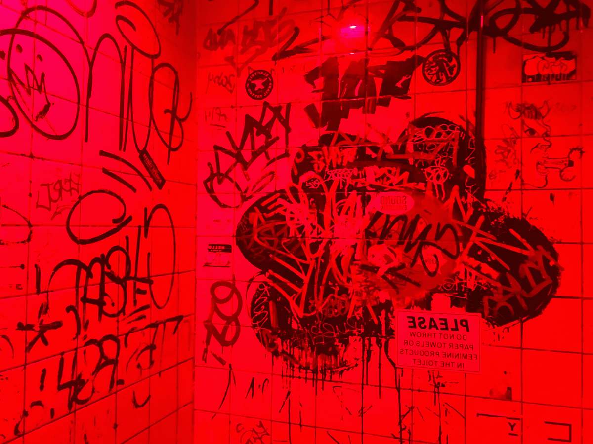 text red surface bathroom in the bar