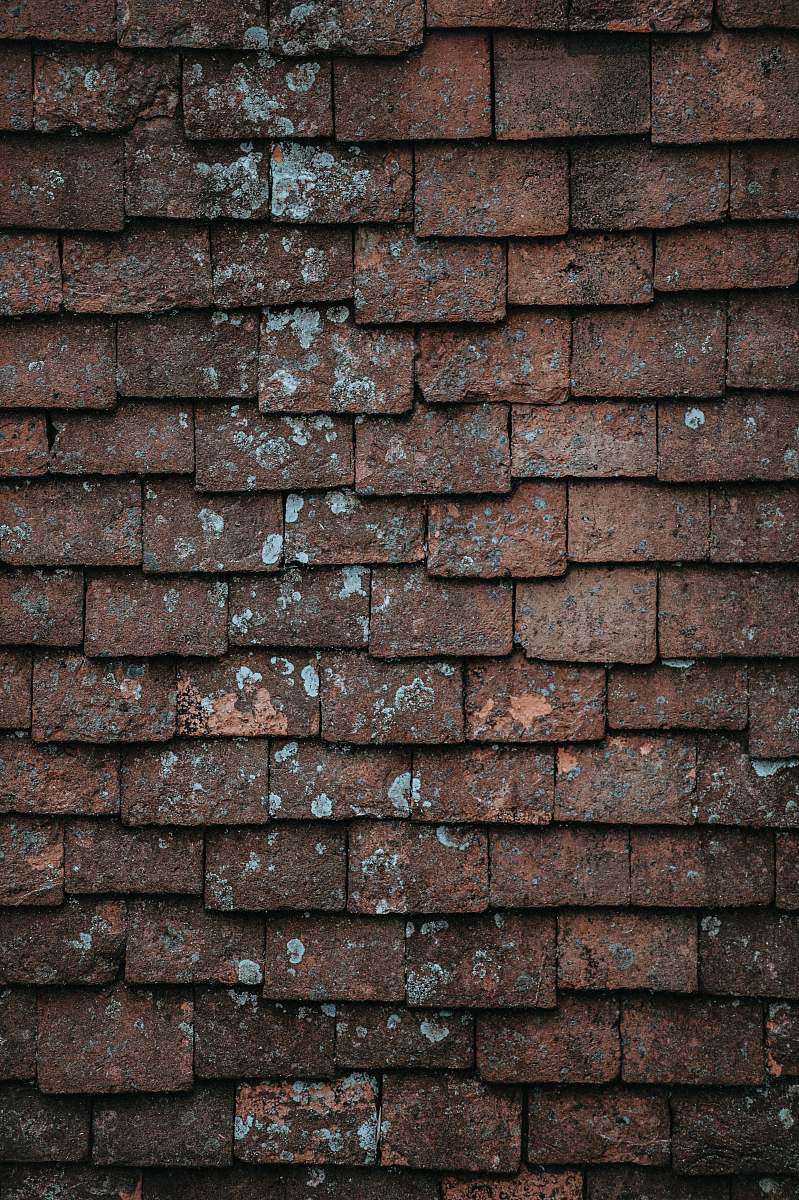 grunge closeup photography of brown and gray concrete bricks pattern