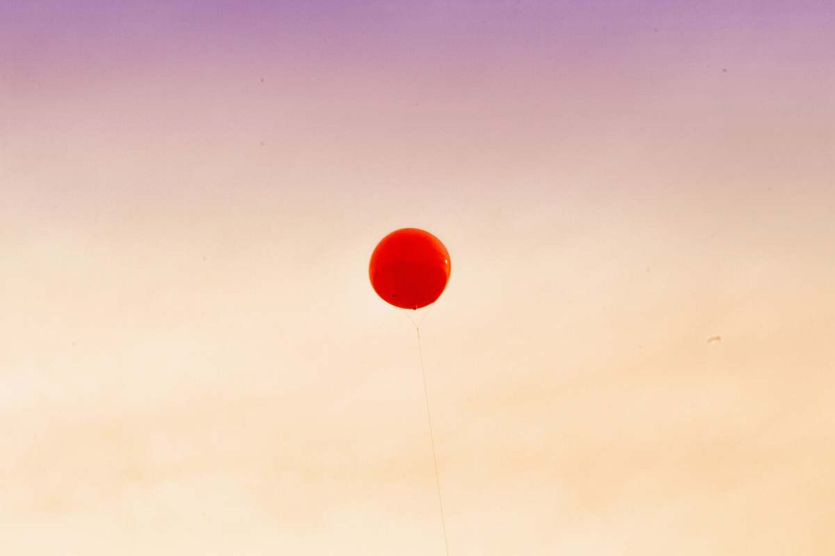 red red balloon floating away the sky balloon