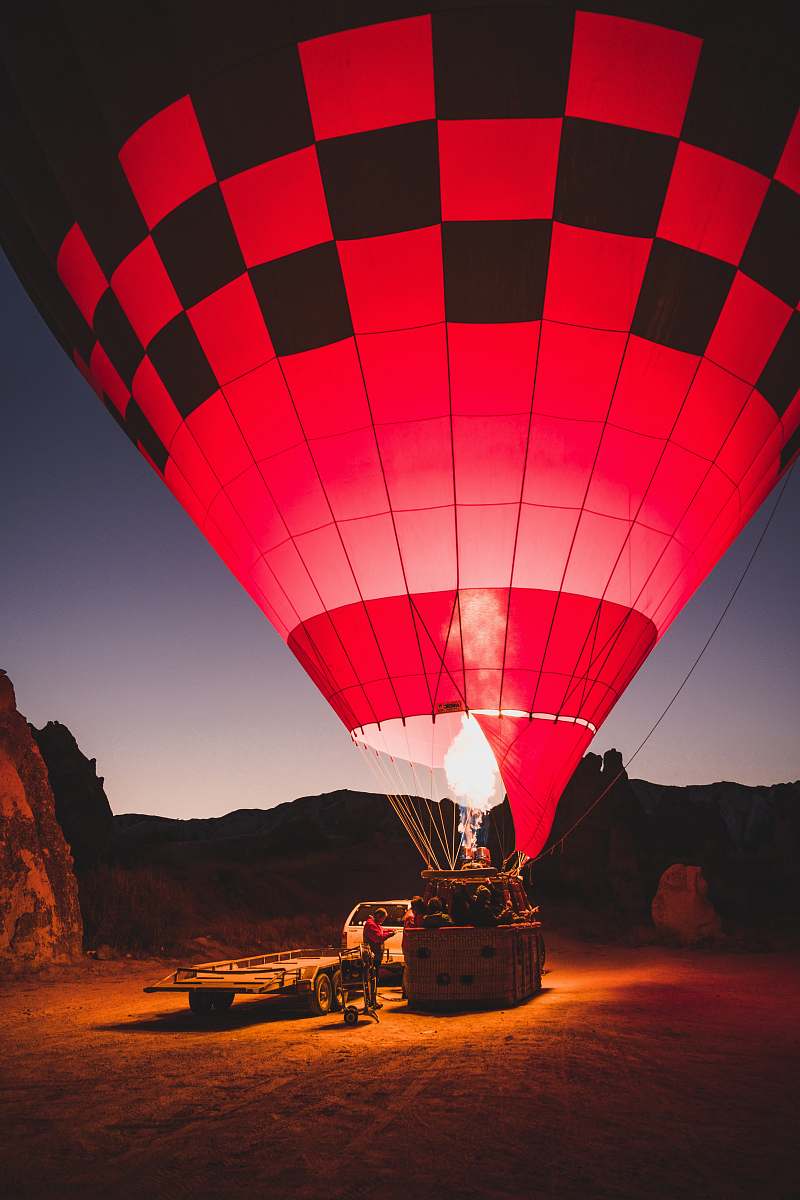 turkey red and black hot air balloon on ground hot air balloon