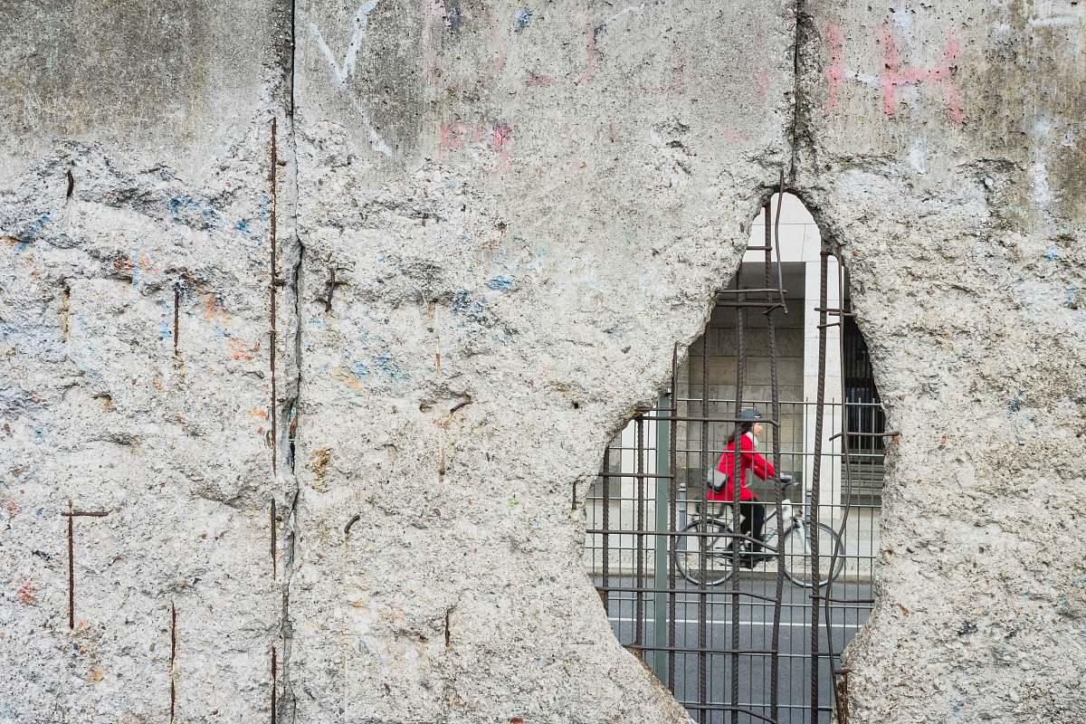 germany woman riding bicycle hole