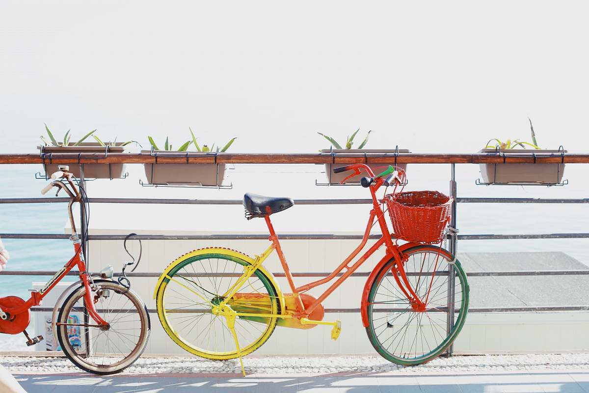 bike two red bicycles near railing vehicle