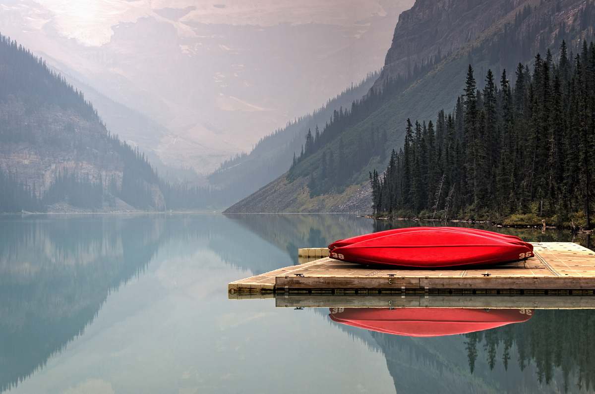 canoe brown floater with red canoe in body of water lake louise
