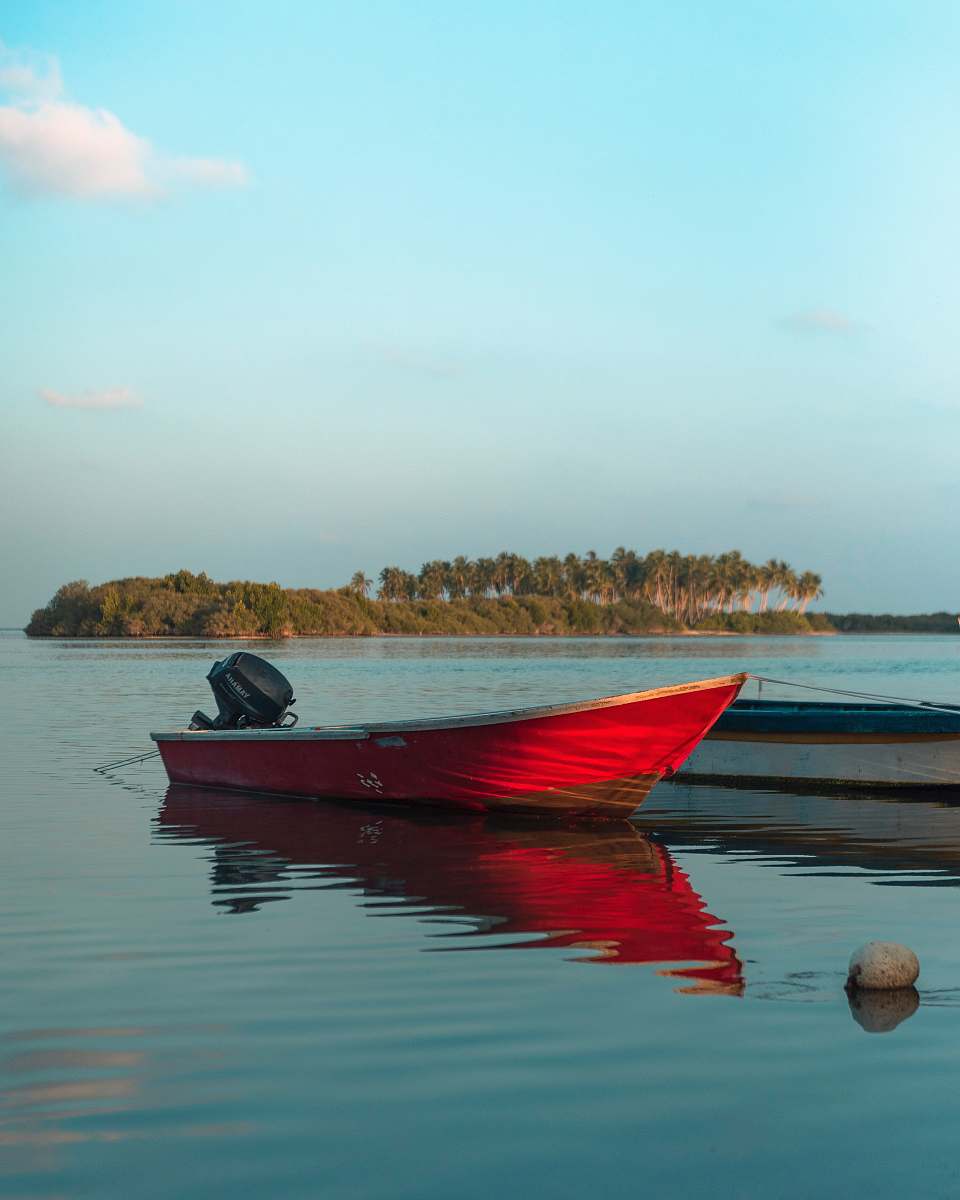 dinghy power boat parked in body of water transportation